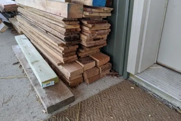 Lumber Pile Near Shop Door